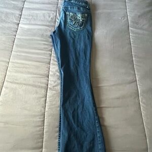 Blue bedazzle flare jeans with a nice curvy fit